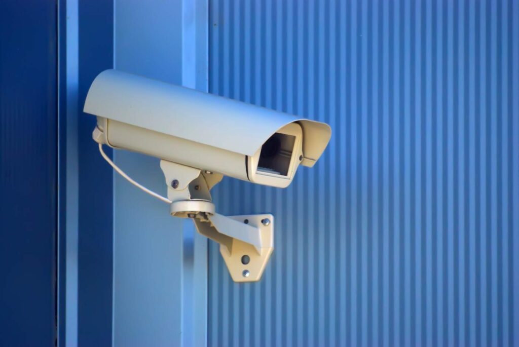 Security camera on the blue wall - compound yards and offices