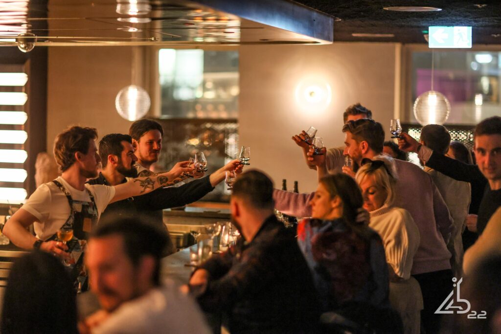 Interior shot of people celebrating inside the bar Lab 22, located in Cardiff